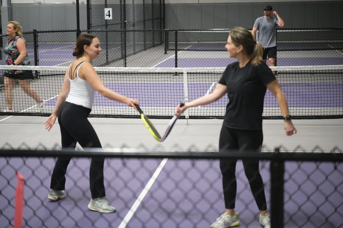 Employees playing pickleball