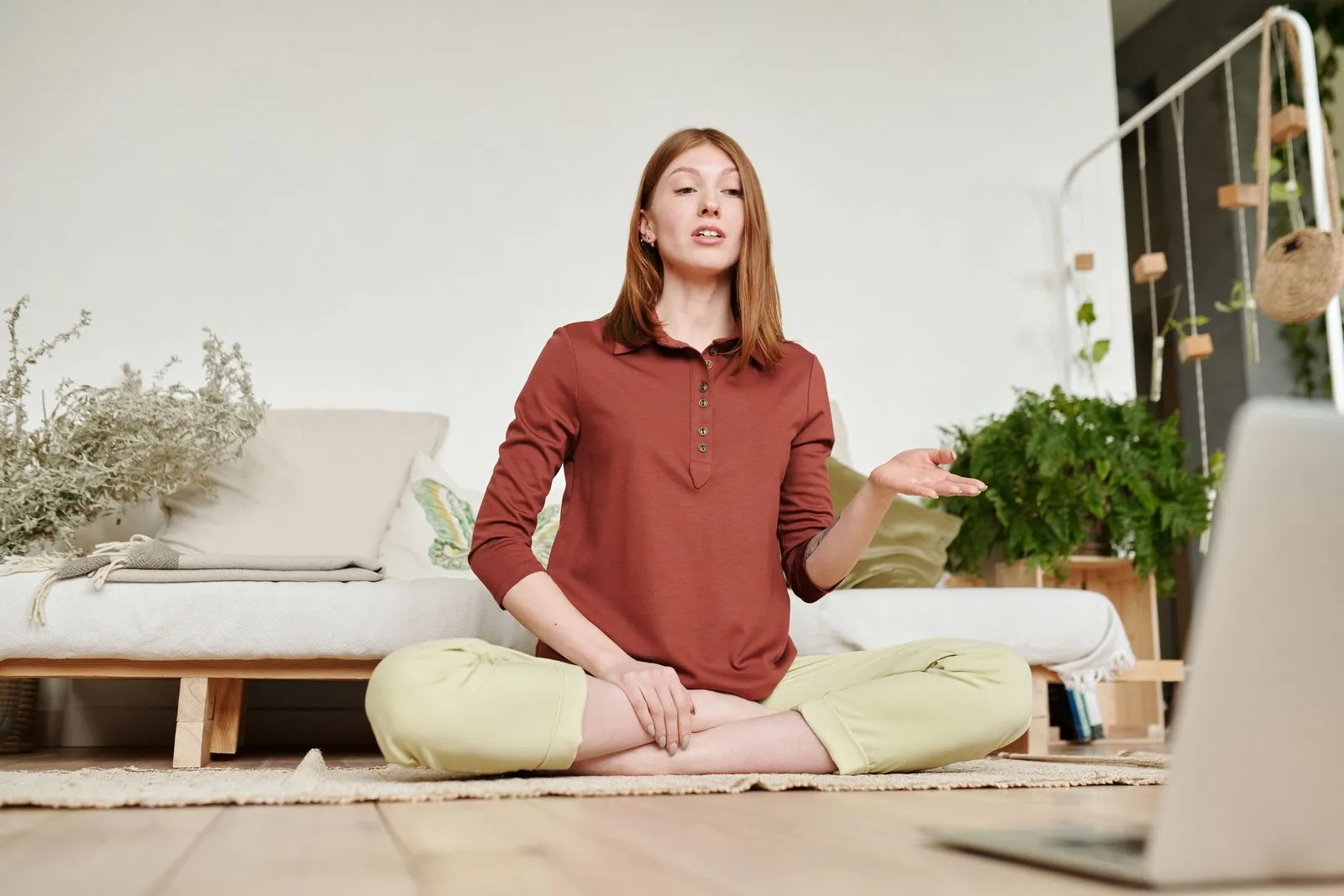 A Fit4Work trainer leading a live remote coaching session from home
