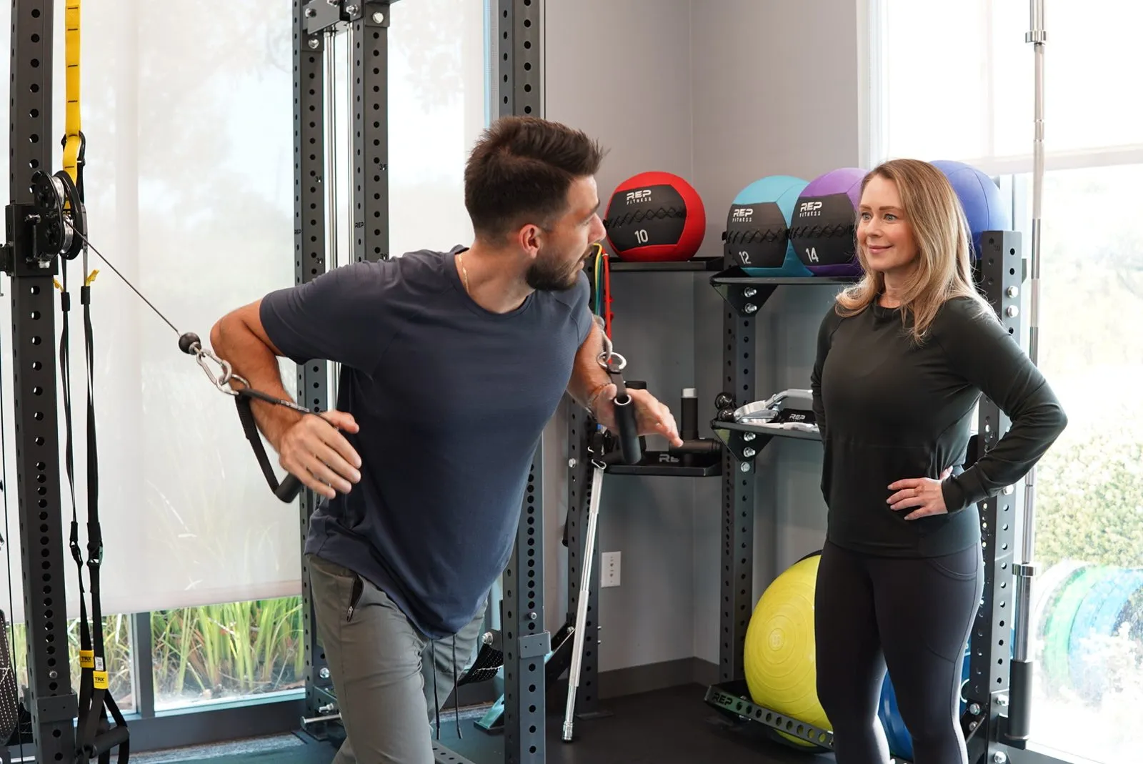 Fit4Work trainer coaching a client during an in-office session